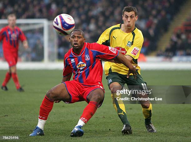 Franck Songo'o of Palace battles with Gary Sawyer of Plymouth during the Coca-Cola Championship match between Crystal Palace and Plymouth Argyle at...