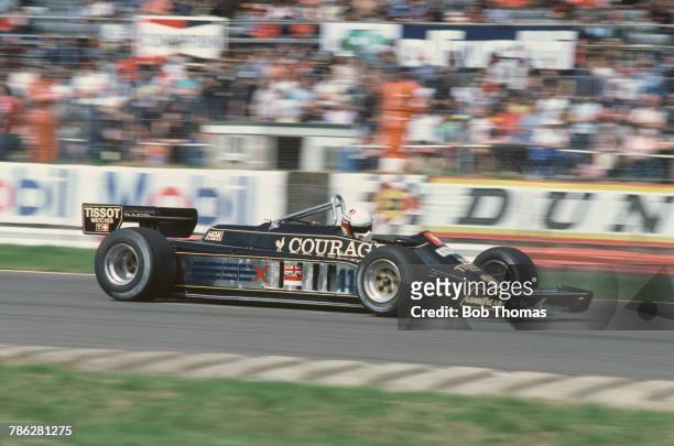 Italian racing driver Elio de Angelis drives the John Player Team Lotus Lotus 87 Ford Cosworth DFV 3.0 V8 in the 1981 British Grand Prix at...
