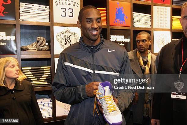 Kobe Bryant of the Los Angeles Lakers shows his new shoe during an unveiling of his new sneaker at the House of Hoops in Harlem on December 22, 2007...