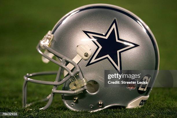 Helmet with a sticker in memory of the late Sean Taylor of the Washington Redskins sits on the field prior to the Dallas Cowboys versus Carolina...