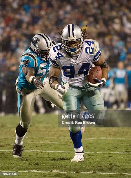Na'il Diggs of the Carolina Panthers works to run down Marion Barber of the Dallas Cowboys during the second half at Bank of America Stadium December...