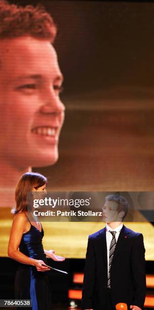 Gymnast and 'Best Sportsman of the Year 2007' award winner Fabian Hambuechen speaks to Presenter Katrin Mueller-Hohenstein during the 'Best Sportsman...