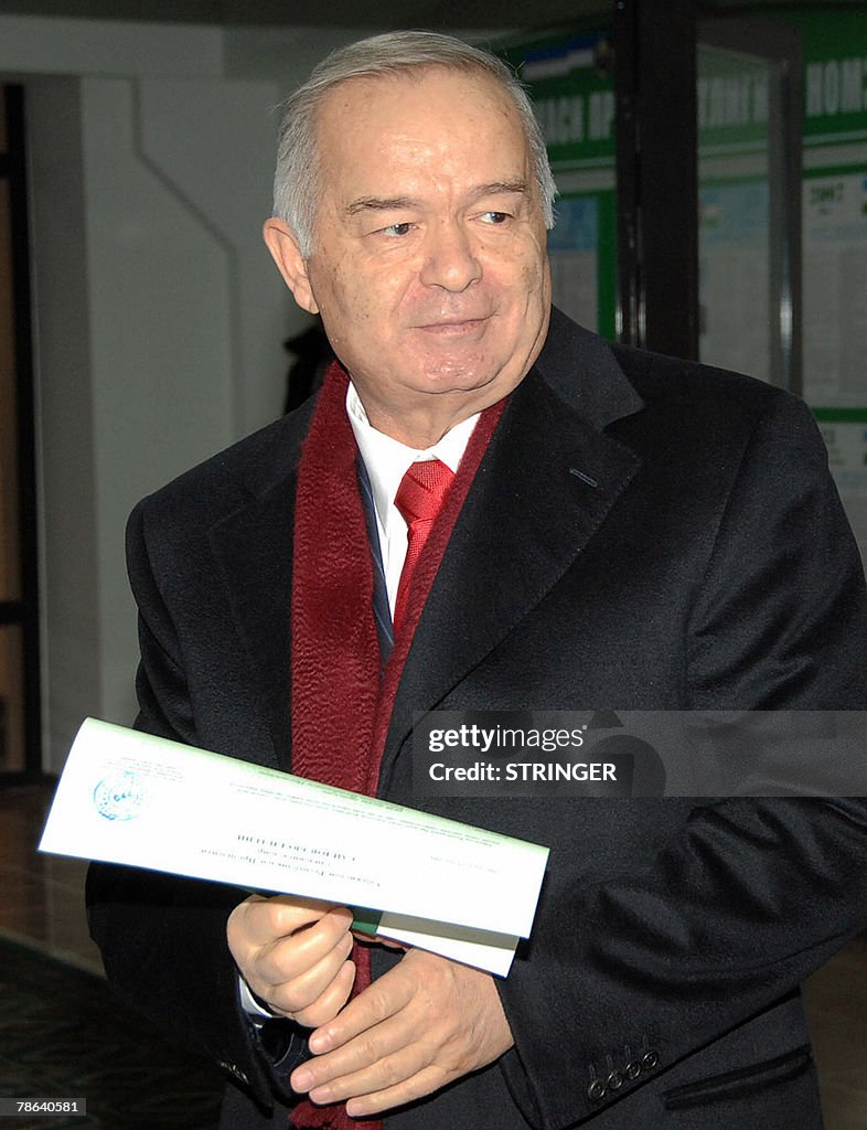 Uzbek President Islam Karimov holds his