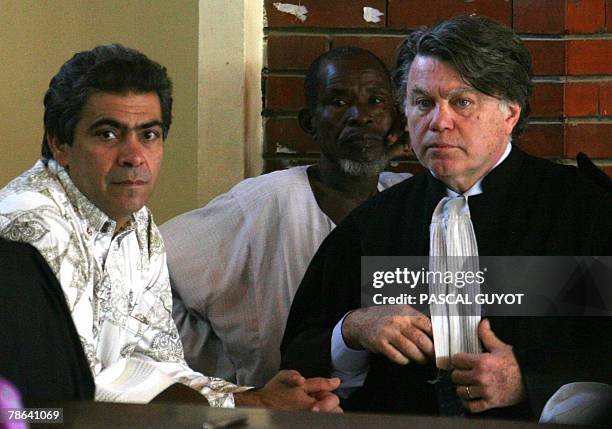 French Philippe Van Wilkelberg , worker of the French charity Zoe's Ark, and Sudanese Souleimane Ibrahim Adam stand next to their lawyer Gilbert...