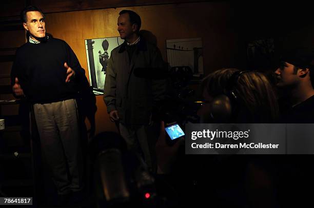 Republican presidential candidate and former Massachusetts Gov. Mitt Romney stands beside his New Hampshire campaign chairman Brian Kehoe during a...