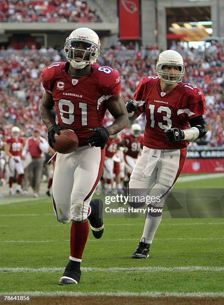 Anquan Boldin of the Arizona Cardinals celebrates his second touchdown of the game in front of Kurt Warner for a 14-7 lead against the Atlanta...