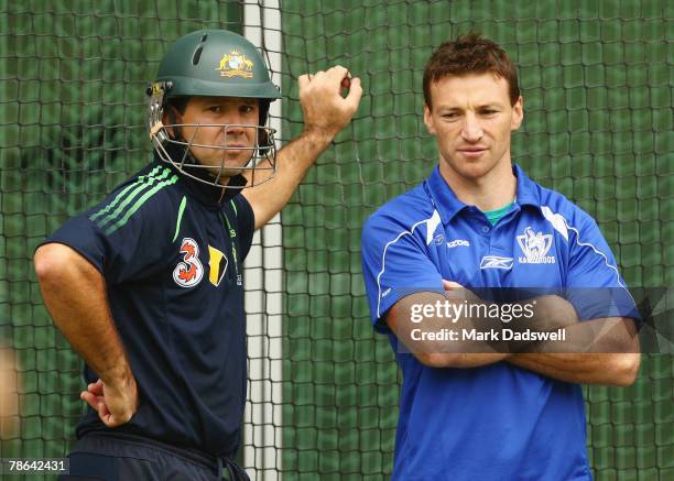 Kangaroo footballer Brent Harvey talks with Australian captain Ricky Ponting during an Australian nets session at the Melbourne Cricket Ground on...