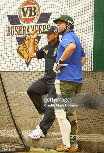 Former AFL Kangaroo footballer Glen Archer talks with Australian captain Ricky Ponting during an Australian nets session at the Melbourne Cricket...