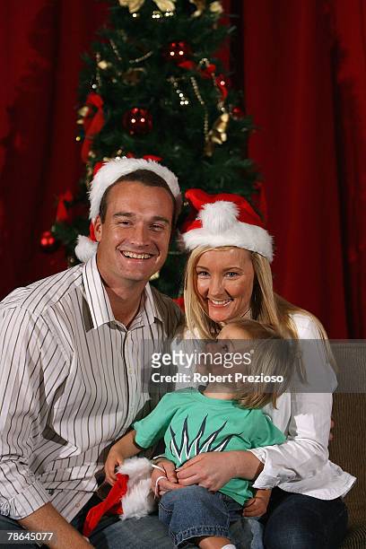 Stuart Clark and wife Michelle with son Lachlan pose for photos during the Australian cricket team Christmas lunch at Crown Casino on December 25,...