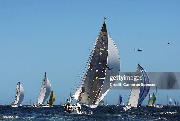 Fleet of yachts head to sea during the start of the 63rd Sydney Hobart Yacht Race on December 26, 2007 in Sydney, Australia. The fleet of 82 boats...