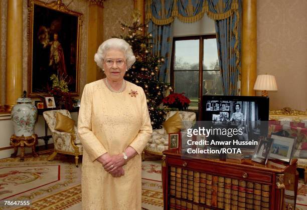 Queen Elizabeth ll delivers her Christmas speech in the 1844 Room at Buckingham Palace, marking the 50th anniversary of her first televised Noel...