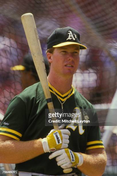 Mark McGwire of the Oakland Athletics looks on before a baseball game against the Boston Red Sox on July 8, 1987 at Fenway Park in Boston,...