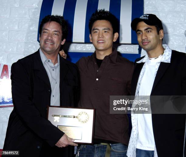 John J. Duran presenting key to the city to John Cho and Kal Penn