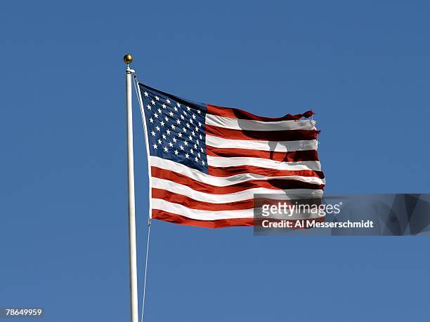 The American Flag flies in a stiff breeze during pre-game ceremonies as the Tampa Bay Buccaneers host the Atlanta Falcons at the Raymond James...