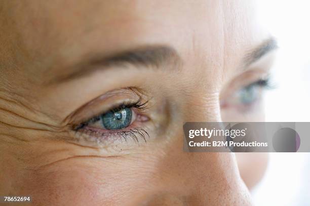 close-up of woman - blue eye close up stock pictures, royalty-free photos & images