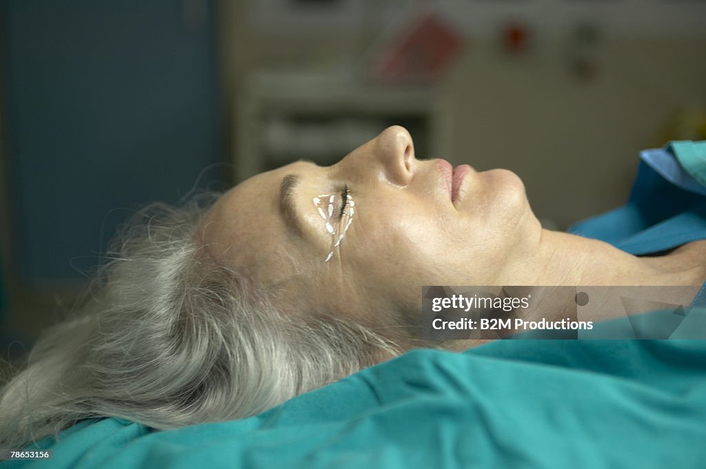 Woman on operating table ready for eyelid surgery