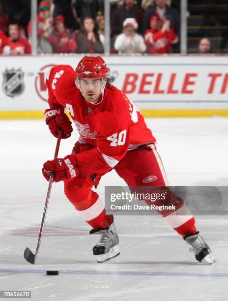 Henrik Zetterberg of the Detroit Red Wings skates in on his shootout attempt against Olie Kolzig of the Washington Capitals during a NHL game on...