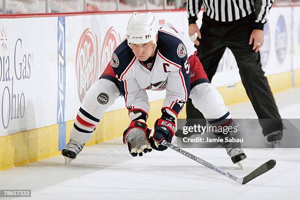 Adam Foote of the Columbus Blue Jackets settles a loose puck with his hands against the Nashville Predators on December 23, 2007 at Nationwide Arena...
