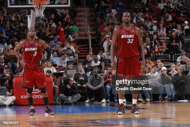 Dwyane Wade and Shaquille O'Neal of the Miami Heat stand on defense during the game against the Philadelphia 76ers on December 26, 2007 at the...