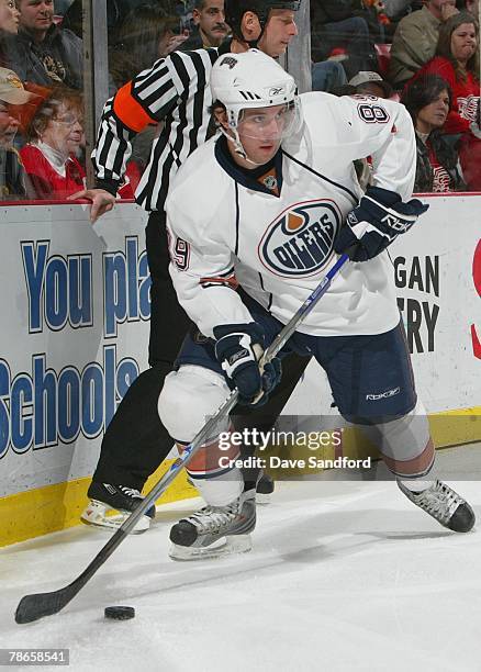 Sam Gagner of the Edmonton Oilers handles the puck against the Detroit Red Wings at Joe Louis Arena on December 13, 2007 in Detroit, Michigan.