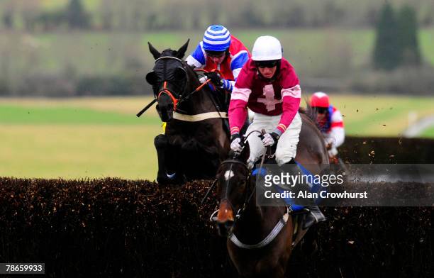 Nadover and Noel Fehily jump the second last fence before winning The coral.co.uk Handicap Chase at Chepstow Racecourse on December 27, 2007 in...