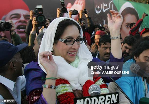 Pakistani former premier Benazir Bhutto smiles during an election compaign rally in Rawalpindi 27 December 2007. Pakistan opposition leader Benazir...