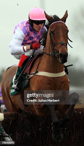 Robert Thornton and Voy Por Ustedes clear an early fence before landing The Desert Orchid Steeple Chase Race run at Kempton Racecourse on December 27...