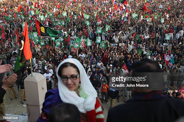 Former Prime Minister Benazir Bhutto prepares to address thousands of supporters at a campaign rally minutes before being assassinated in a bomb...