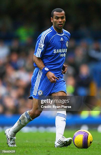 Ashley Cole of Chelsea runs with the ball during the Barclays Premier League match between Chelsea and Aston Villa at Stamford Bridge on December 26,...