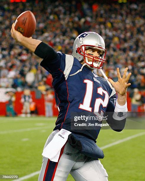 Tom Brady of the New England Patriots prepares to the face the Miami Dolphins at Gillette Stadium on December 23, 2007 in Foxborough, Massachusetts....