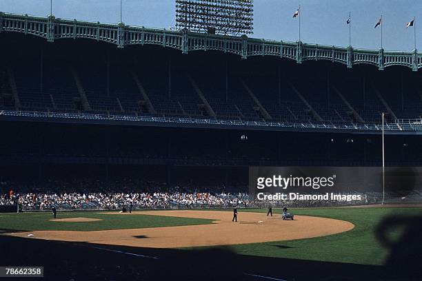 General view of Yankee Stadium as the grounds crew finishes preparing the field prior to the start of a game on April 21, 1954 between the Boston Red...