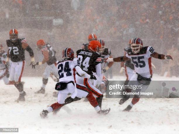 Wide receiver Joe Jurevicius of the Cleveland Browns catches a pass between Terrence McGee and Angelo Crowell of the Buffalo Bills during a game on...