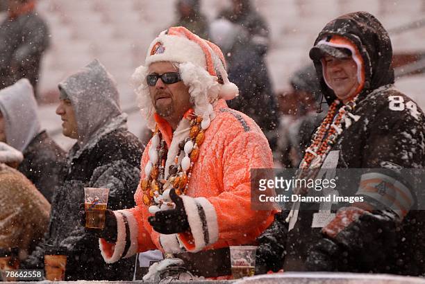 These Cleveland Browns fans brave the cold and snow during a game between the Buffalo Bills and Cleveland Browns on December 16, 2007 at Cleveland...