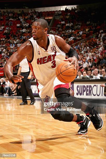 Dwyane Wade of the Miami Heat drives to the basket during the game against the Charlotte Bobcats on November 27, 2007 at American Airlines Arena in...