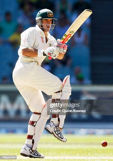 Matthew Hayden of Australia plays a pull shot during day three of the First Test match between Australia and India at the Melbourne Cricket Ground on...