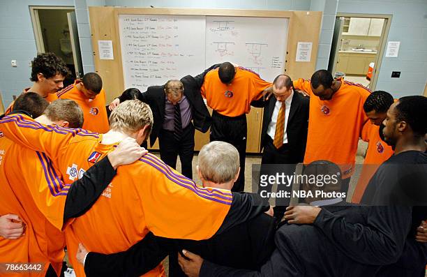 Head coach Nick Nurse of the Iowa Energy leads his team through a prayer in the locker room before the game against the Sioux Falls Skyforce on...
