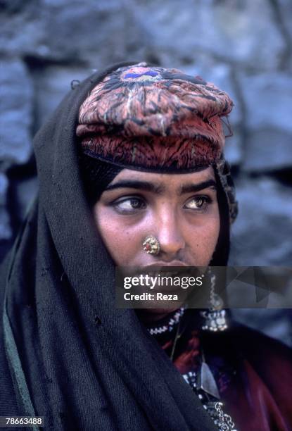 Portrait of a woman come to see Benazir Bhutto and Asif Zardari wed on December 18 at the Clifton Palace garden in Karachi, Pakistan. Benazir broke...