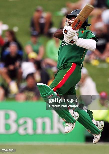 Aftab Ahmed of Bangladesh plays a shot off the ground during the second one day international match between New Zealand and Bangladesh held at McLean...