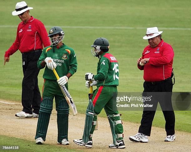 Umpires Tony Hill and Peter Parker and Mushifiqur Rahim and Farhad Reza if Bangladesh walk off due to rain during the second one day international...