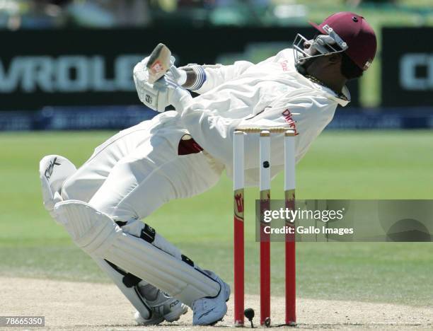 Chris Gayle ducks a bouncer from Dale Steyn during Day 3 of the 1st Test match between South Africa and West Indies at the Sahara Oval, St Georges...