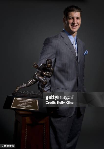 Quarterback Tim Tebow of the University of Florida poses with the Heisman Trophy. Tebow was named the 73rd Heisman Trophy Winner on December 8, 2007...