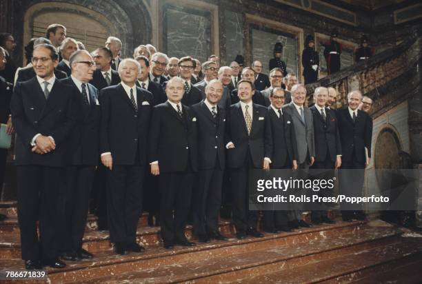 View of European leaders standing together in a group on the grand staircase of the Egmont Palace for the signing of the accession treaty by Denmark,...