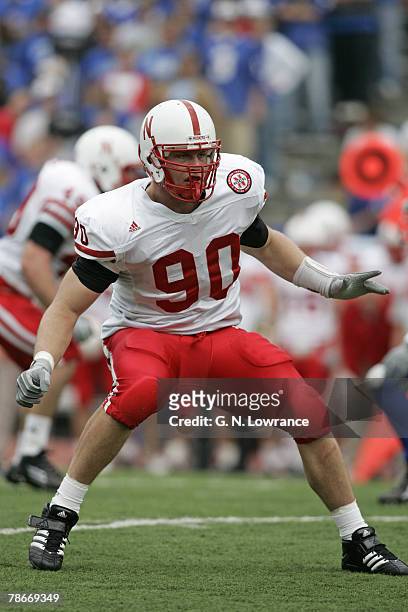 Adam Carriker of the Nebraska Cornhuskers pursues on a play during a game against the Kansas Jayhawks at Memorial Stadium in Lawrence, Kansas on...