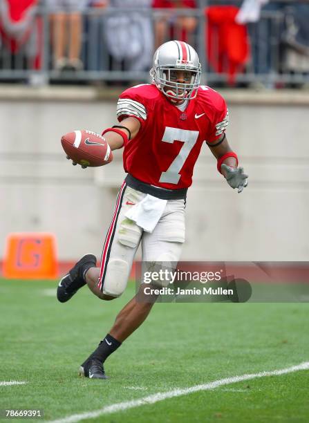 Ohio State Wide Receiver and Kick Returner, Ted Ginn, Jr., runs back a kickoff during the game against the Iowa Hawkeyes, September 24 in Columbus,...