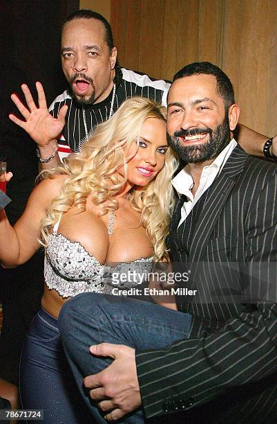 Actor/rapper Ice-T, his wife, model Nicole "Coco" Austin, and The Opium Group partner Roman Jones, pose at the New Year's weekend kickoff party for...