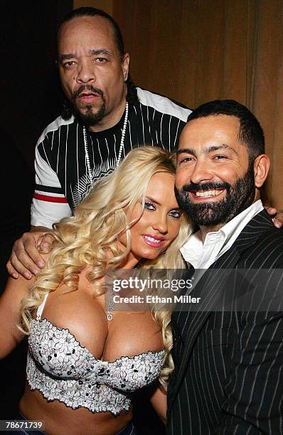 Actor/rapper Ice-T, his wife, model Nicole "Coco" Austin, and The Opium Group partner Roman Jones, pose at the New Year's weekend kickoff party for...