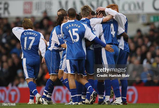 Kalifa Cisse of Reading is congratulted by Teammates after scoring to level the scores at 1-1 during the Barclays Premier League match between...