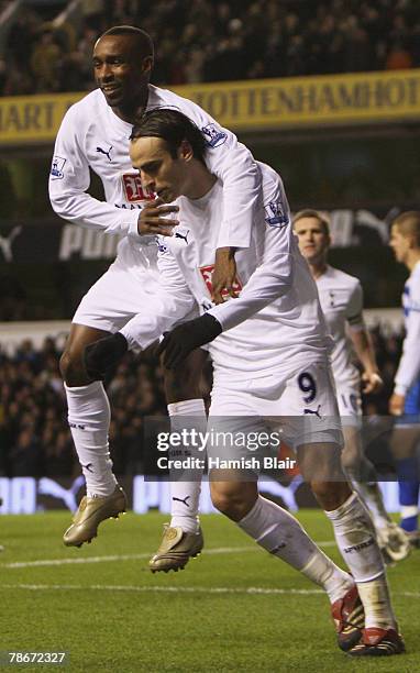 Dimitar Berbatov of Spurs is congratulated by teammate Jermain Defoe after levelling the scores at 2-2 during the Barclays Premier League match...