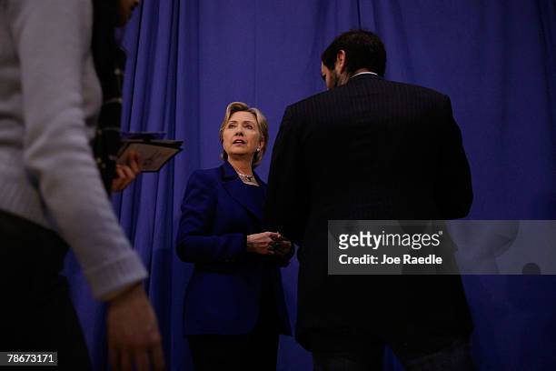 Democratic presidential candidate Sen. Hillary Clinton speaks to her staff during a campaign stop December 29, 2007 in Eldridge, Iowa. With the Iowa...