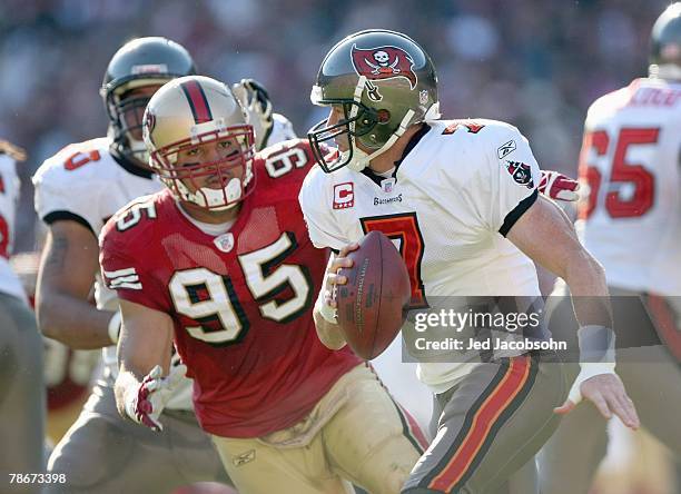 Jeff Garcia of the Tampa Bay Buccaneers tries to avoid Tully Banta -Cain of the San Francisco 49ers at Monster Park on December 23, 2007 in San...